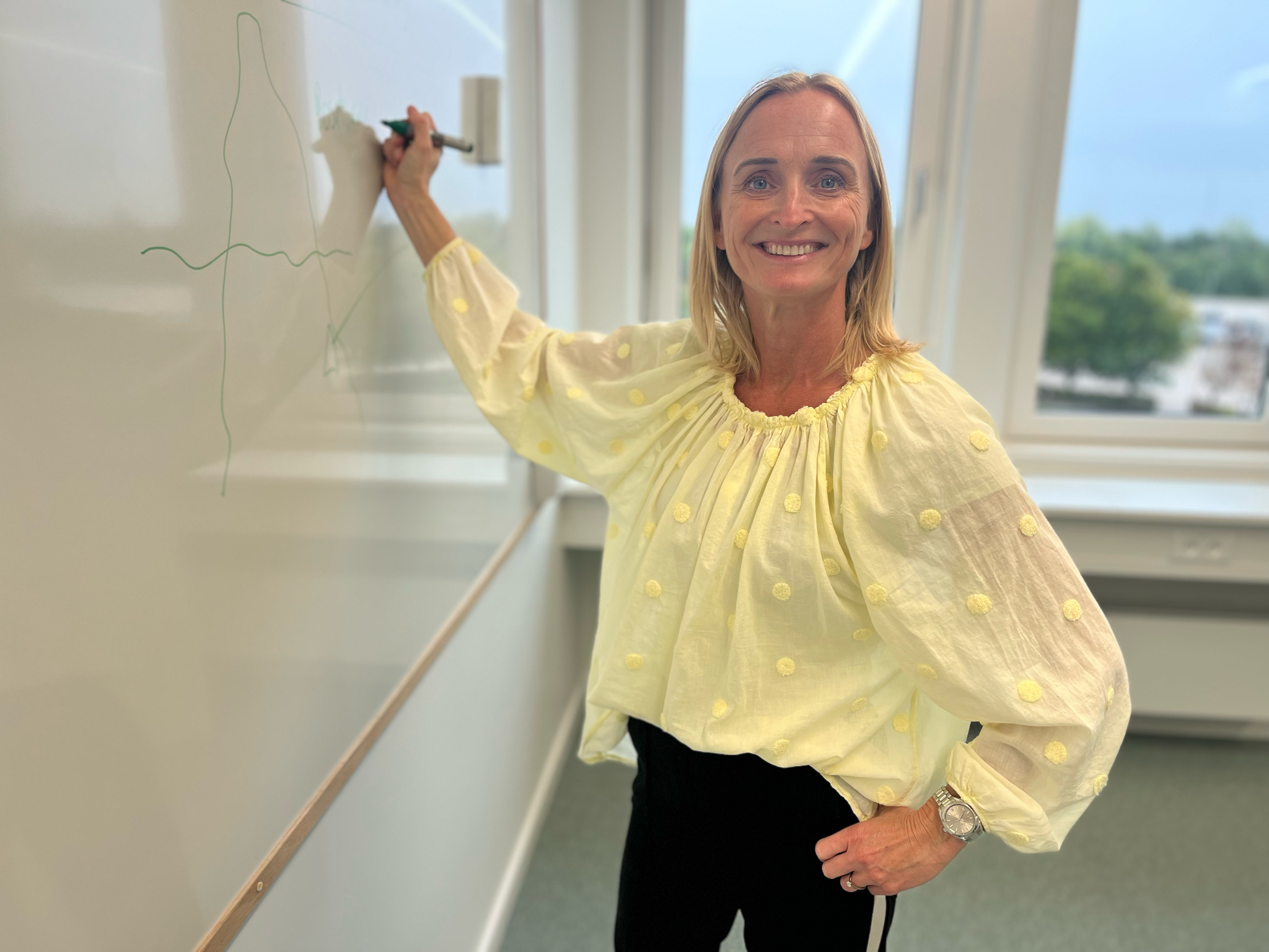 Rikke la Cour at a whiteboard